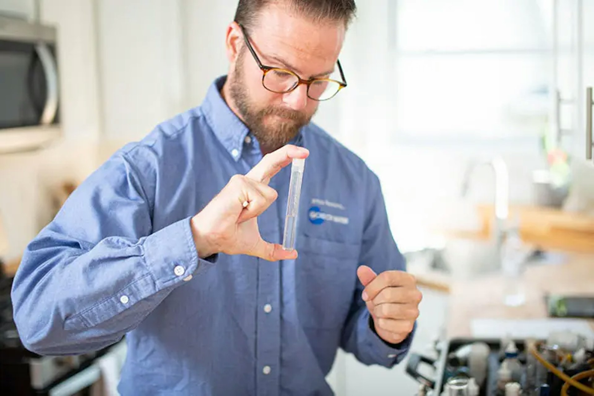 Water Specialist Ben Roper conducts a water test in a client’s home